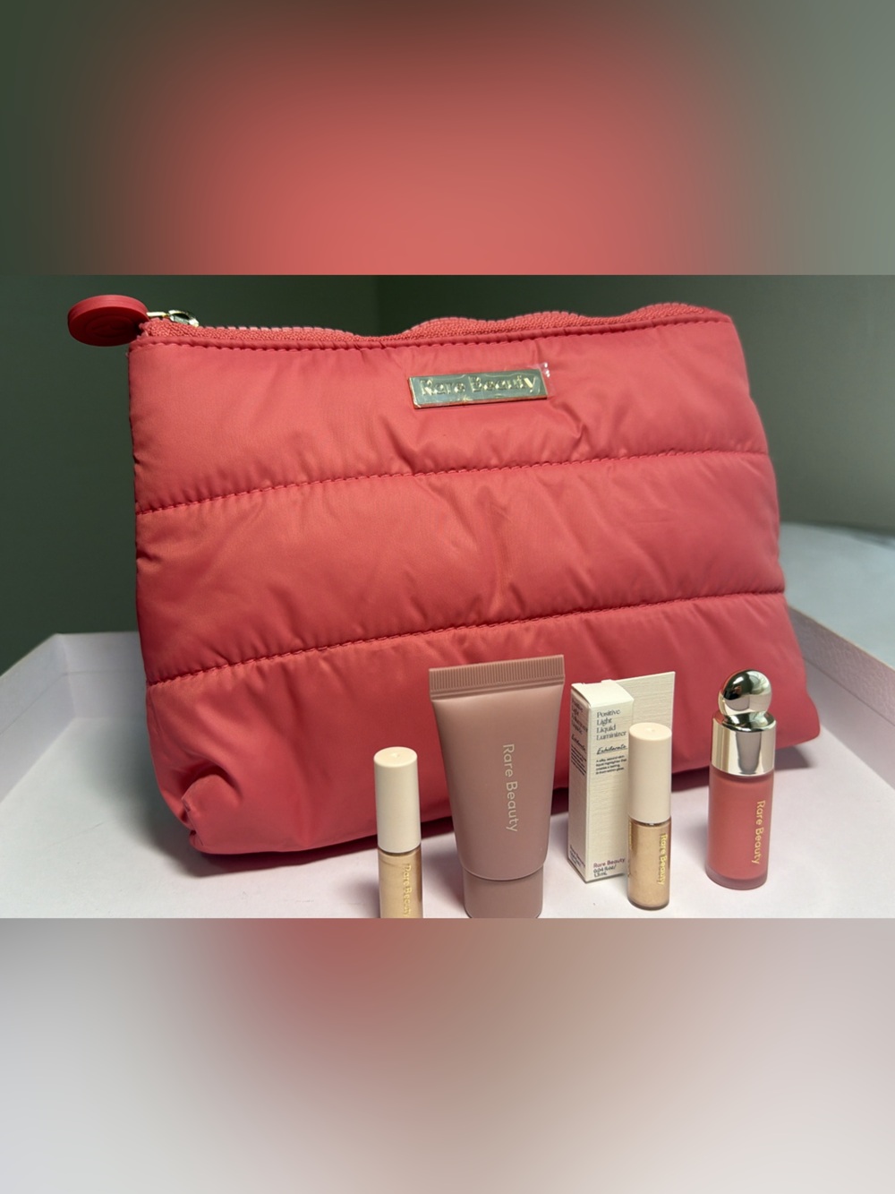 New,unused & authentic Rare Beauty Coral Pink Quilted Cosmetic Bag with samples
